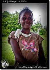 Local girl with pet rat, Belize